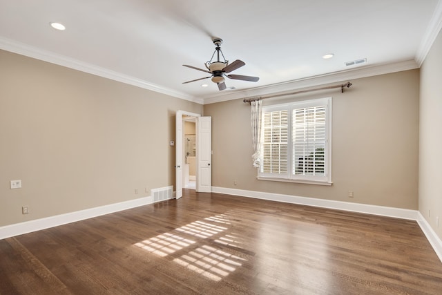 spare room featuring crown molding, ceiling fan, and dark wood-type flooring