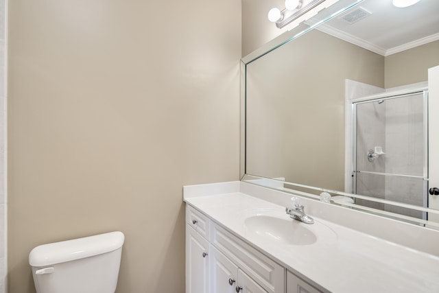 bathroom featuring vanity, toilet, an enclosed shower, and crown molding