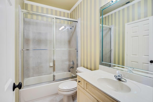 full bathroom with tile patterned floors, vanity, crown molding, enclosed tub / shower combo, and toilet