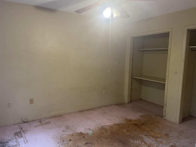 unfurnished bedroom with multiple closets and ceiling fan