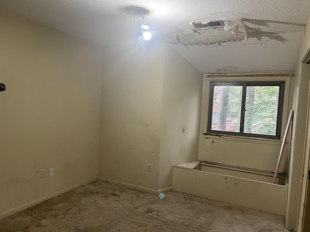 empty room with light carpet and baseboards