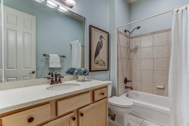 full bathroom featuring tile patterned floors, vanity, toilet, and shower / tub combo