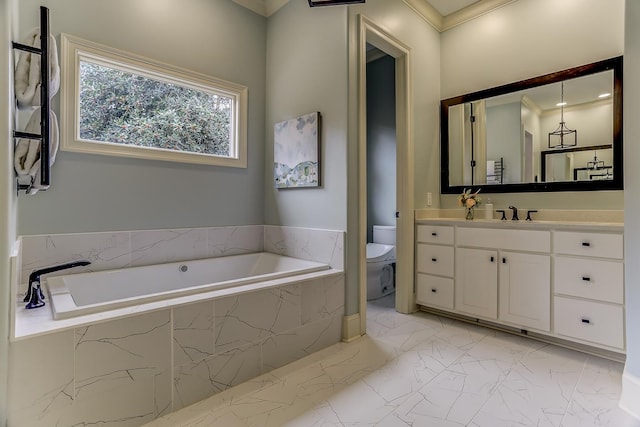 bathroom with tiled tub, vanity, ornamental molding, and toilet