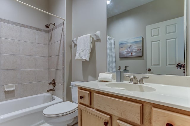 full bathroom with vanity, toilet, and shower / tub combo