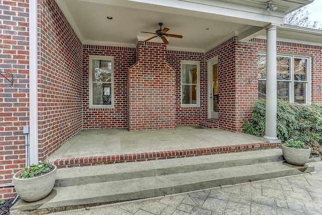 entrance to property featuring ceiling fan