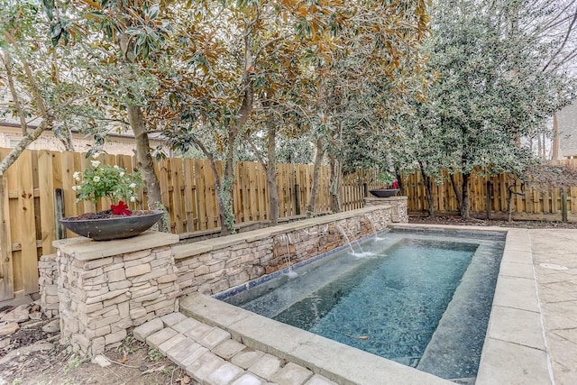 view of swimming pool featuring pool water feature