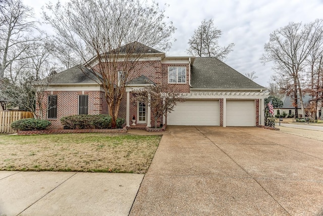 front of property featuring a front lawn and a garage