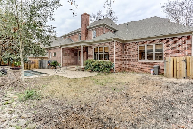 rear view of property featuring a patio area