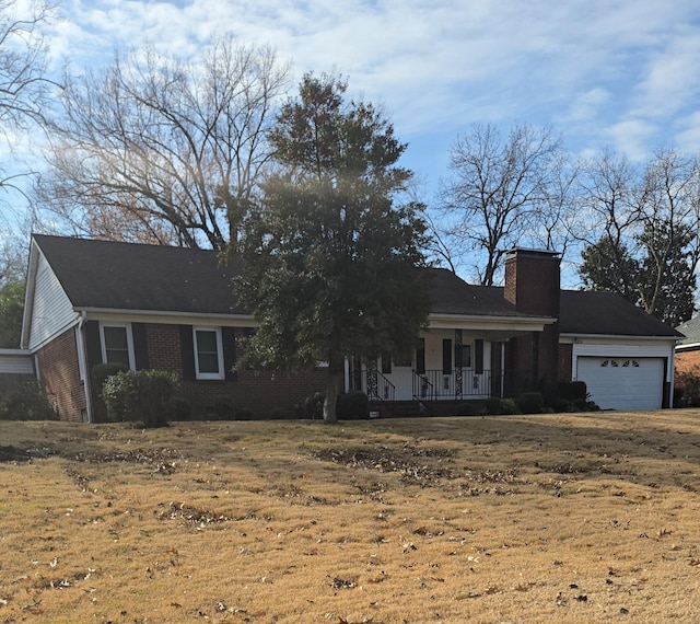 view of front facade featuring a porch and a garage