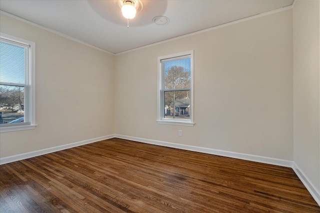 empty room with dark hardwood / wood-style floors, ceiling fan, and crown molding