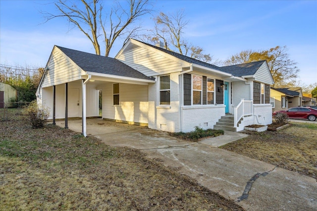 view of front of property featuring a carport