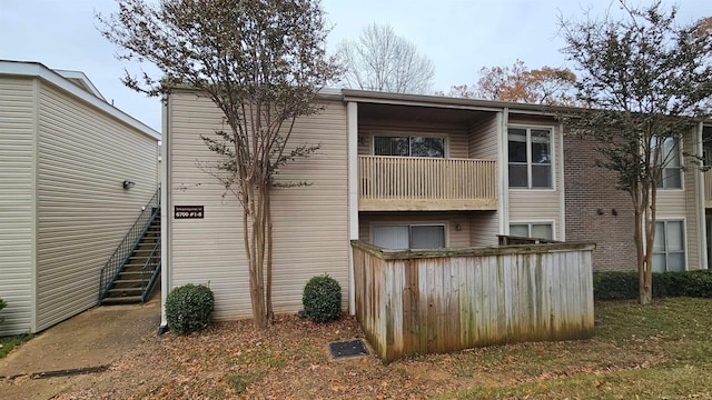 rear view of house with a balcony