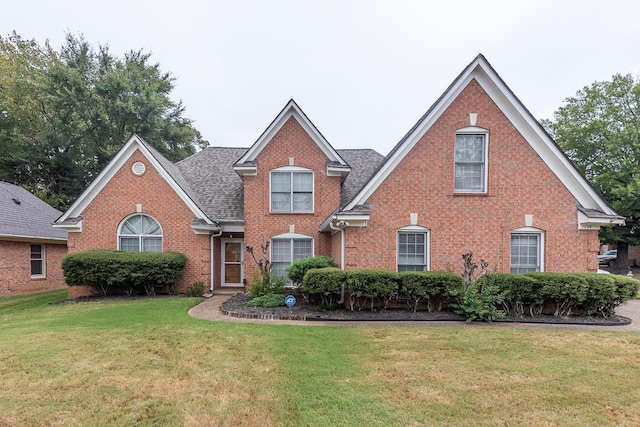 front facade with a front yard