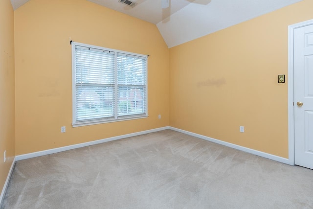 unfurnished room with light carpet, ceiling fan, and lofted ceiling