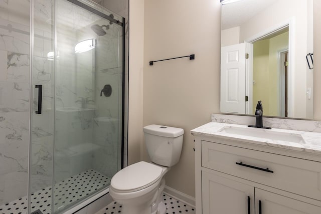 bathroom with vanity, toilet, and walk in shower