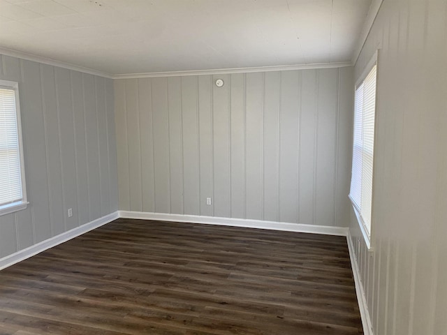 unfurnished room with dark hardwood / wood-style floors and ornamental molding