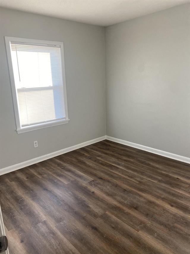 empty room featuring dark hardwood / wood-style floors