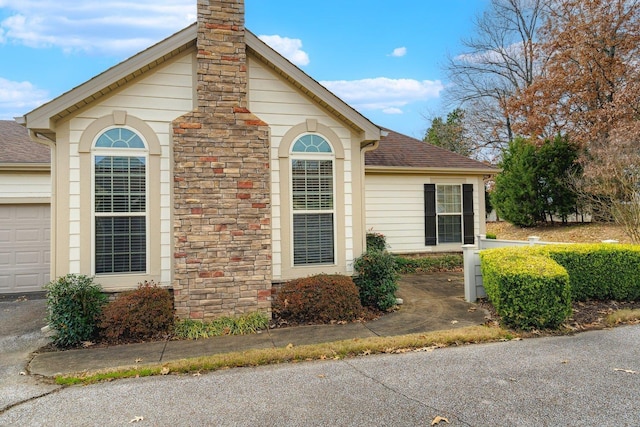 view of property exterior with a garage