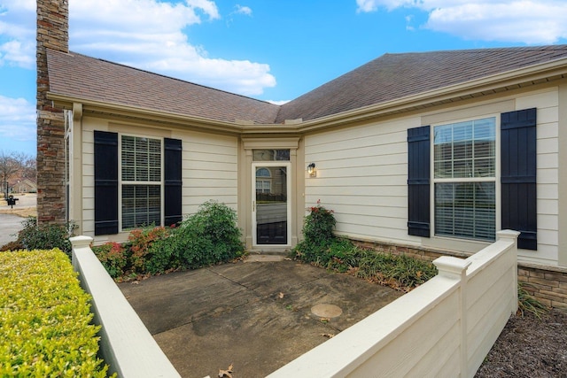 entrance to property featuring a patio