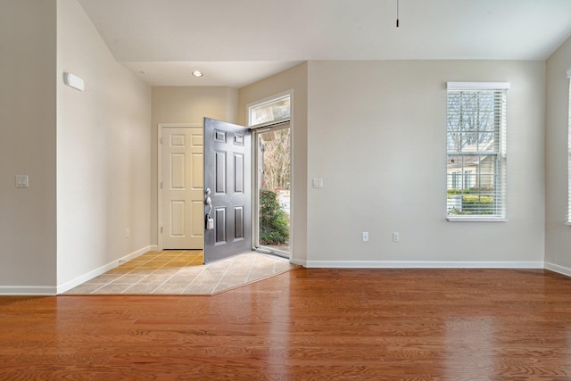 entryway with light hardwood / wood-style flooring and plenty of natural light