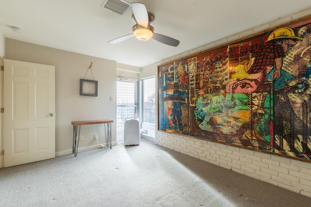 spare room featuring carpet floors and ceiling fan