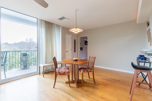 dining space featuring light hardwood / wood-style flooring and ceiling fan