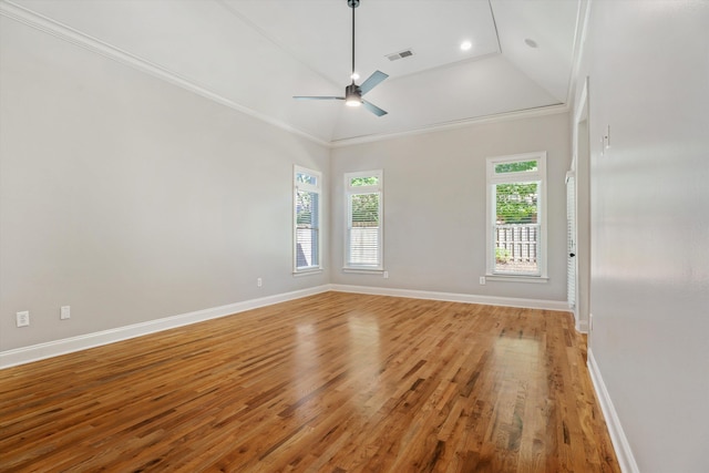 spare room with ceiling fan, light hardwood / wood-style floors, ornamental molding, and high vaulted ceiling