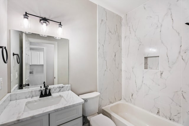 full bathroom with vanity, toilet, and tiled shower / bath combo