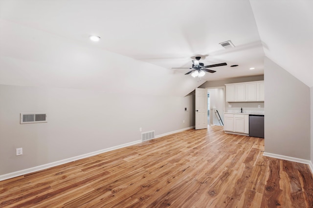 bonus room with ceiling fan, lofted ceiling, and light hardwood / wood-style flooring