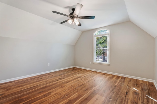 additional living space featuring hardwood / wood-style flooring, ceiling fan, and lofted ceiling