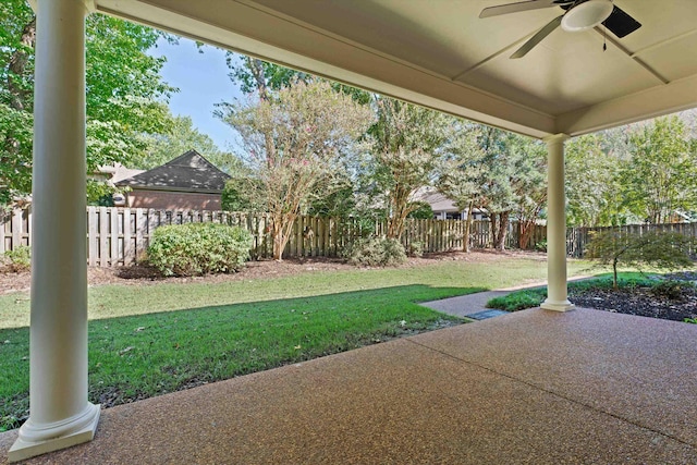 view of yard featuring ceiling fan and a patio area