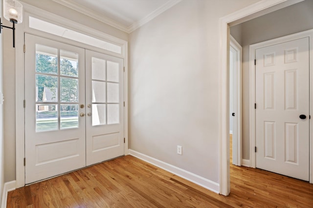 doorway to outside featuring crown molding, french doors, and light hardwood / wood-style flooring