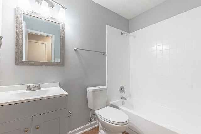 full bathroom featuring vanity, toilet, shower / bath combination, and a textured ceiling