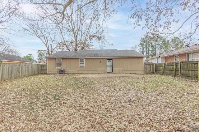 rear view of property featuring a patio area and central air condition unit