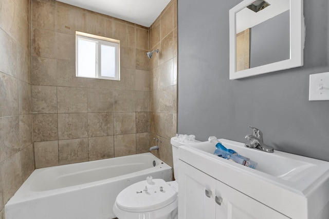 full bathroom with vanity, toilet, and tiled shower / bath