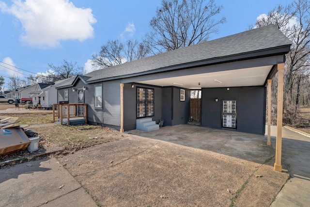 view of front of property with a carport