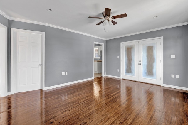 empty room with french doors, dark hardwood / wood-style floors, ceiling fan, and ornamental molding