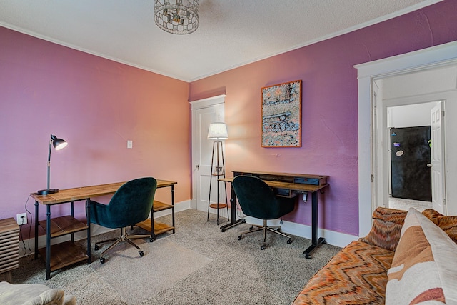 home office with carpet, a textured ceiling, and ornamental molding