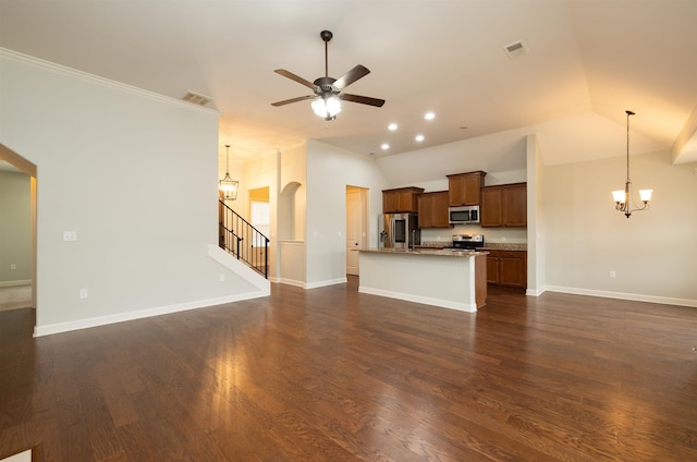 unfurnished living room with ceiling fan, dark hardwood / wood-style floors, lofted ceiling, and crown molding