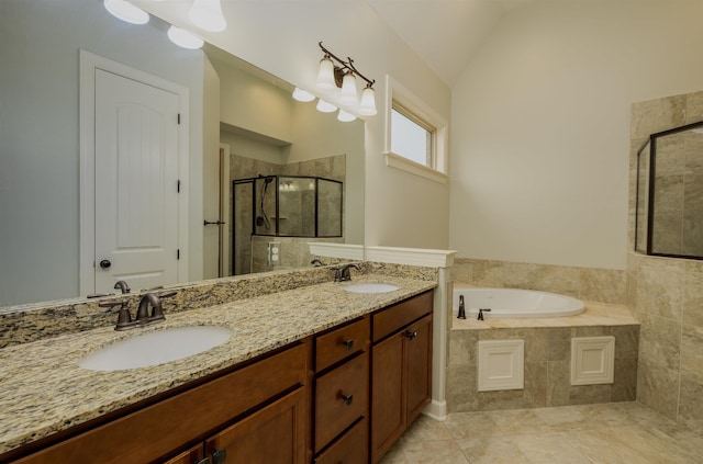 bathroom with vanity, lofted ceiling, and independent shower and bath