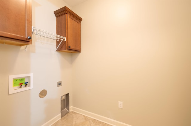 laundry area featuring electric dryer hookup, cabinets, and washer hookup