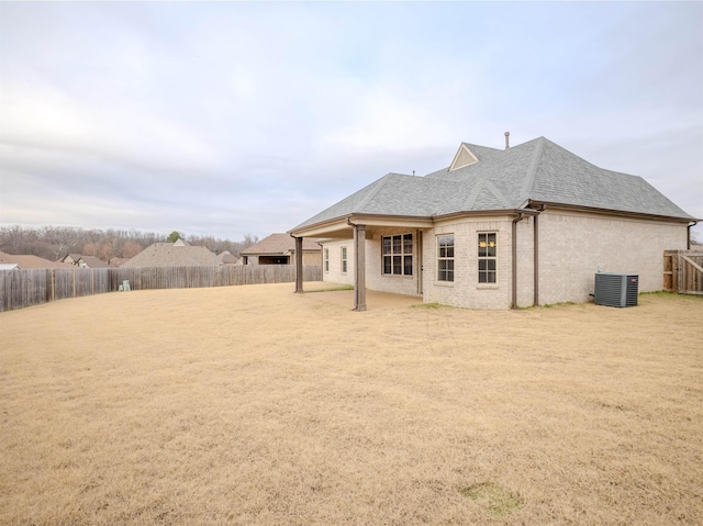 back of property with central AC unit