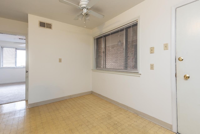 unfurnished room with ceiling fan