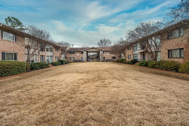 view of home's community featuring a yard