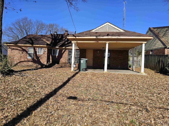 rear view of house with a carport