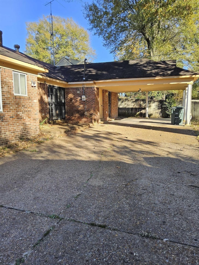 view of front of home featuring a carport