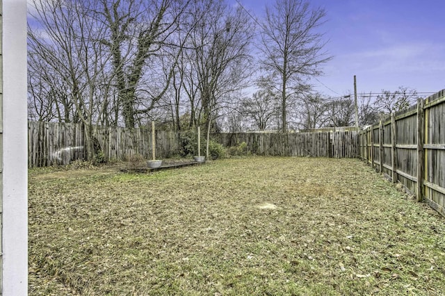 view of yard with a fenced backyard