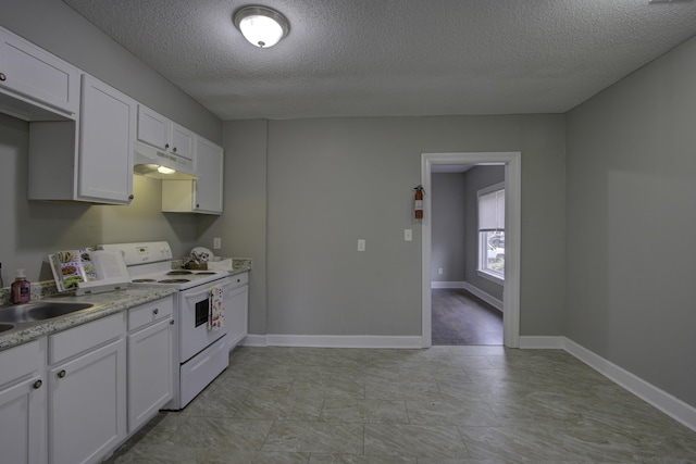 kitchen featuring under cabinet range hood, white electric stove, white cabinetry, and a sink