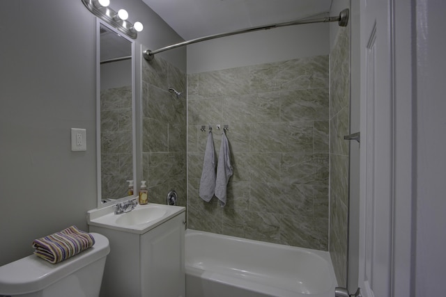 full bathroom featuring vanity, toilet, and tiled shower / bath