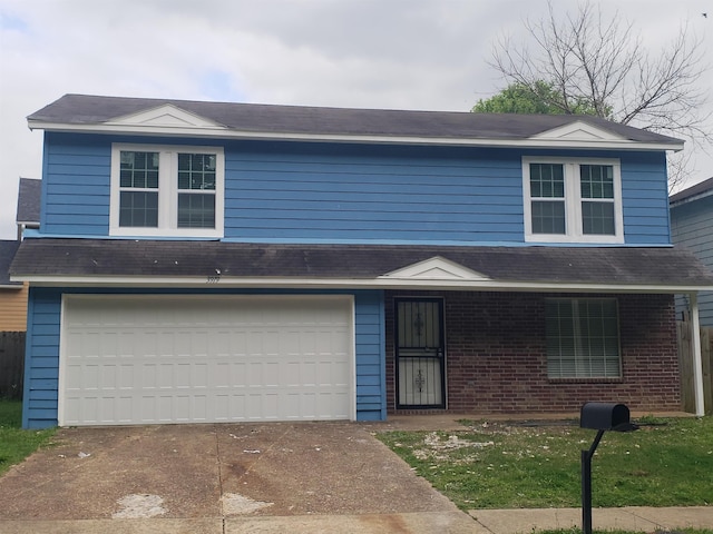 front of property with a garage